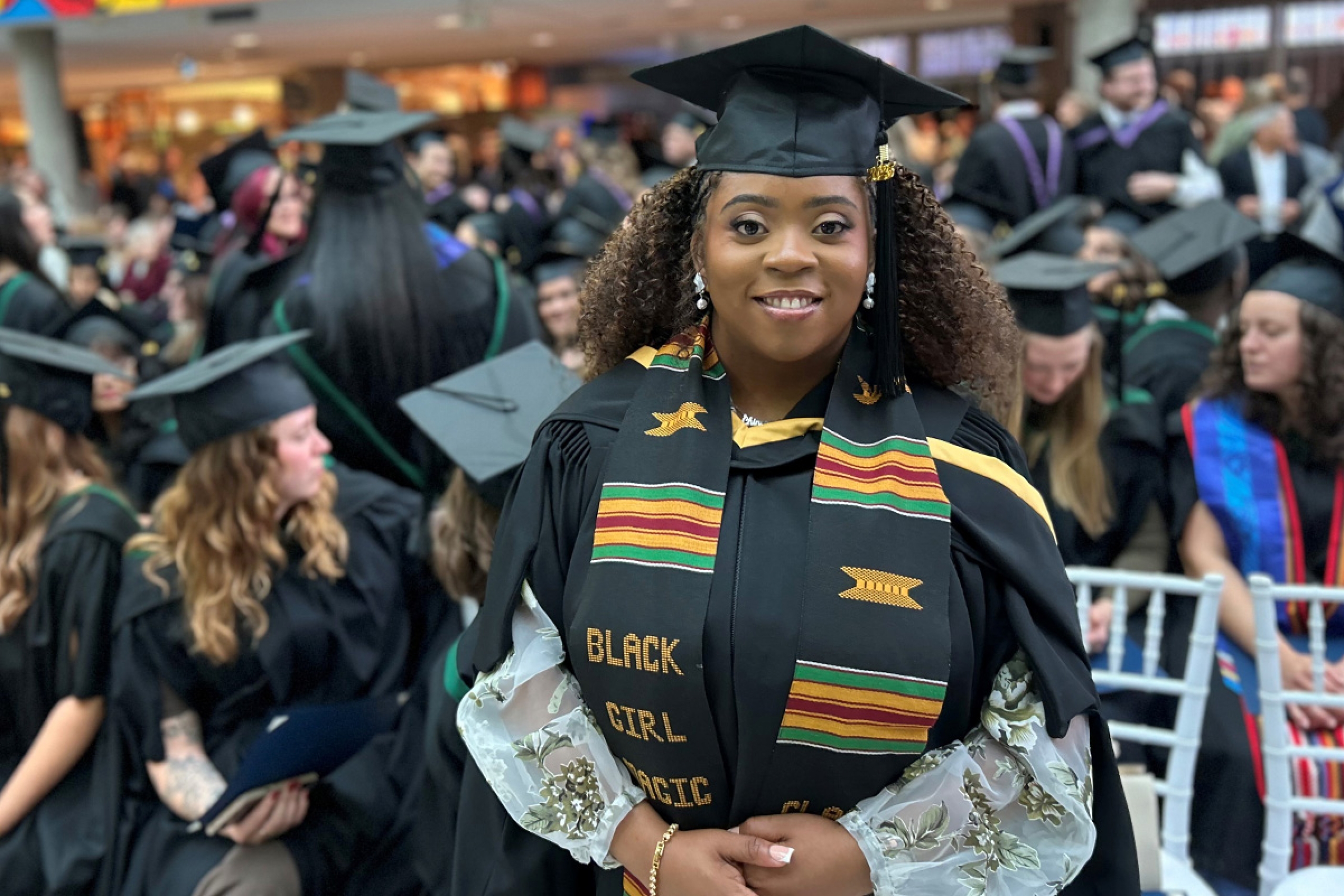 Praise Okafor poses following the convocation ceremony at the Brodie atrium at Bannatyne campus.