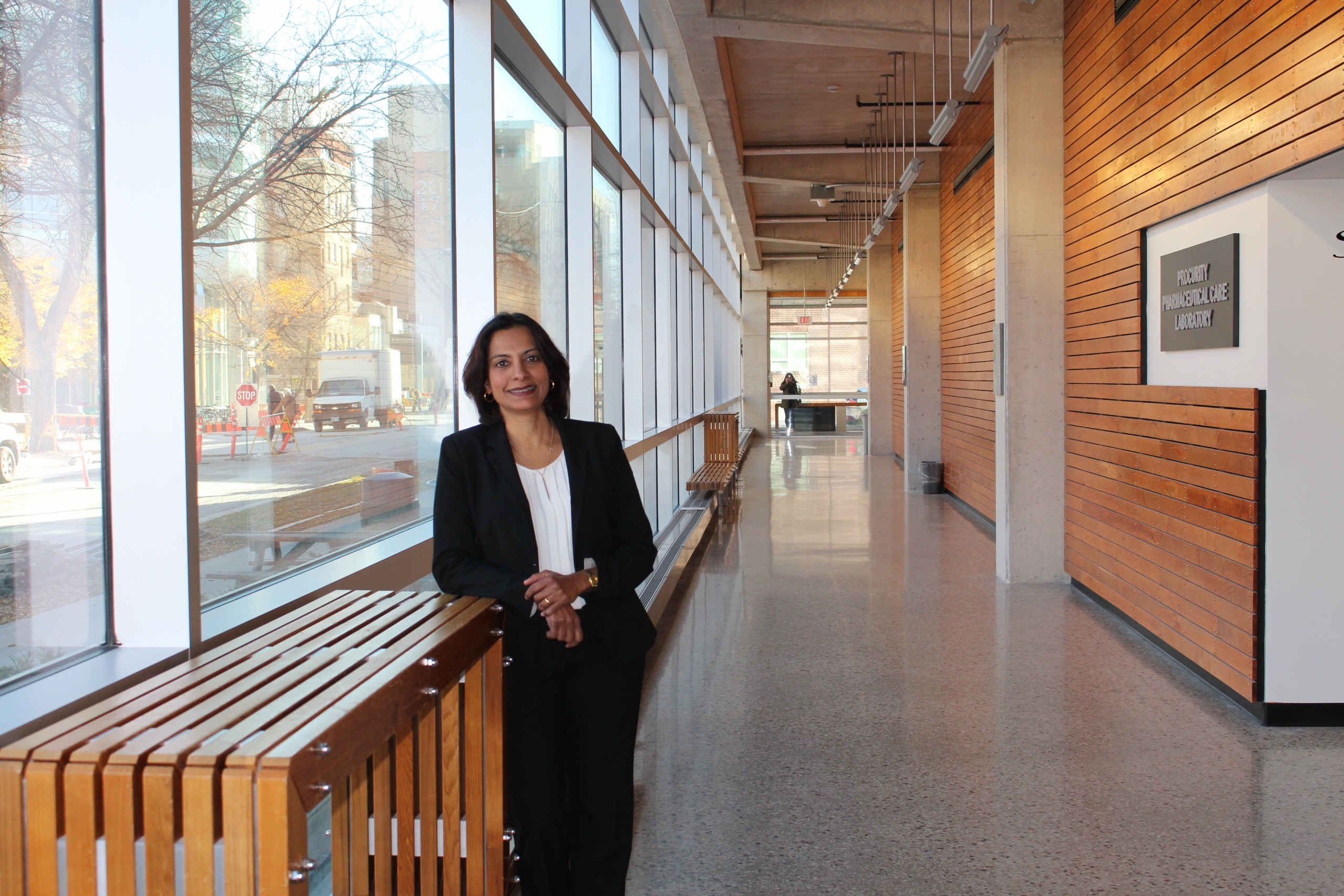 Lalitha Raman-Wilms at a hallway at the Apotex Centre.