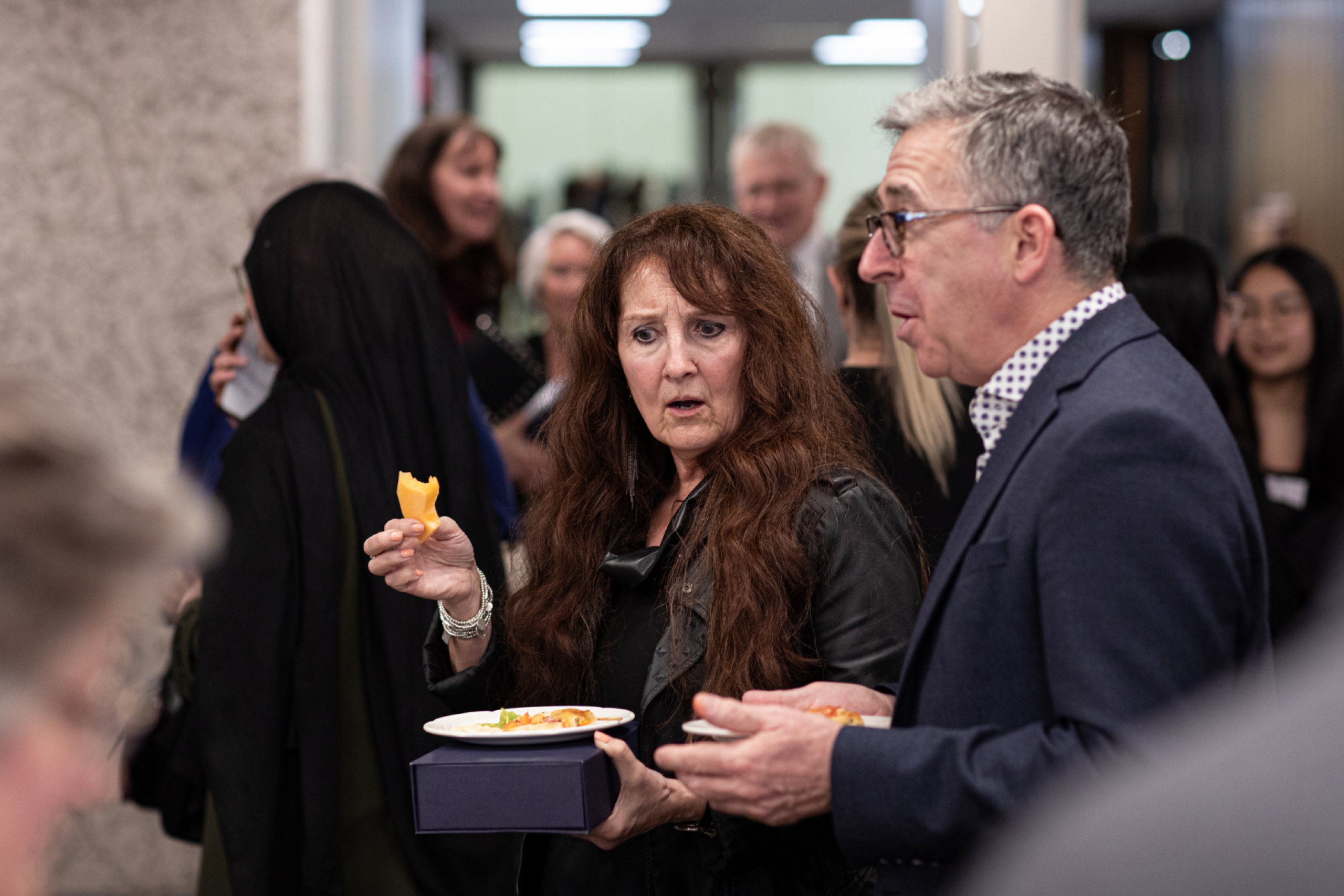 A group of people talking at the STRR event. 