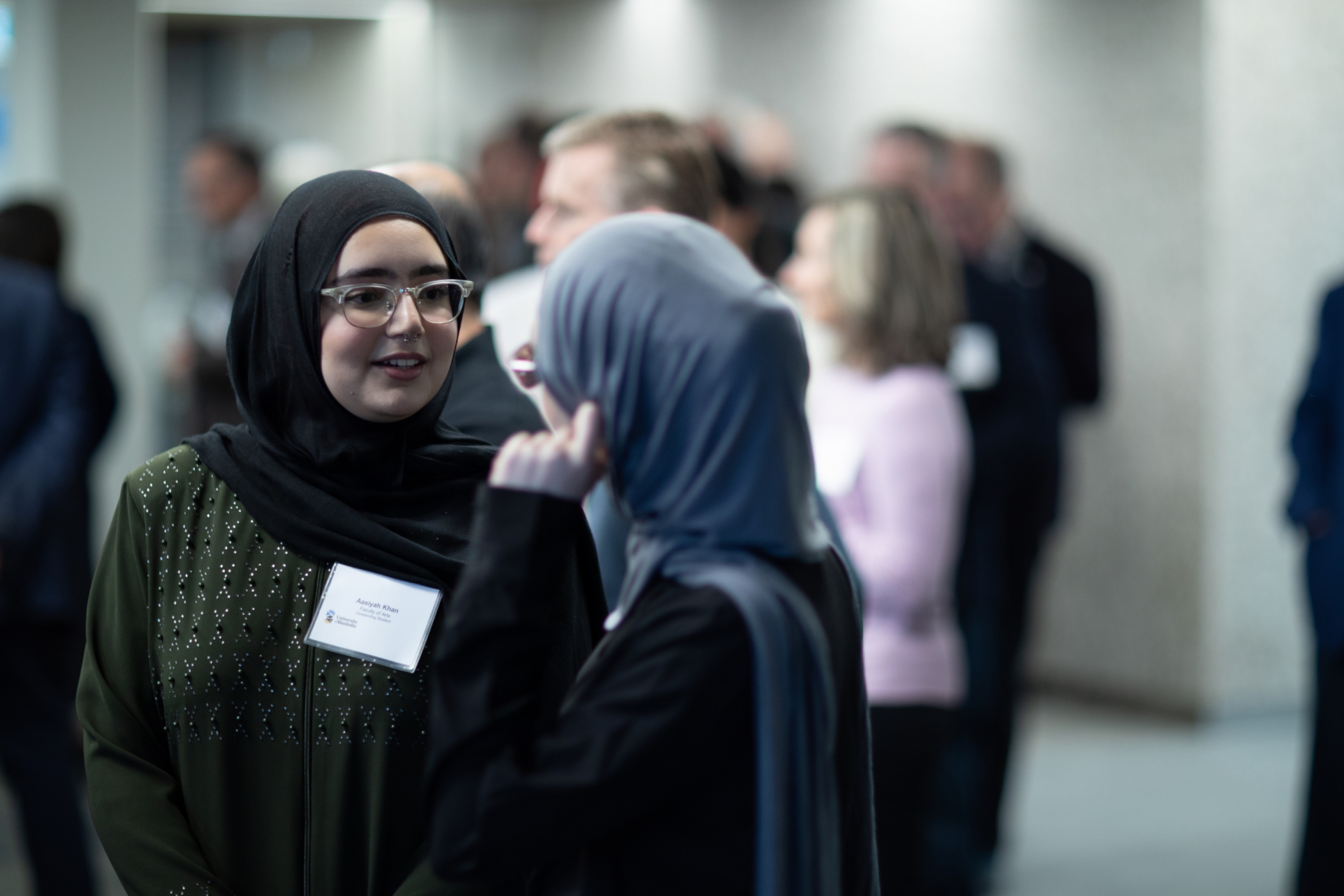 Two women talking at the STRR event. 