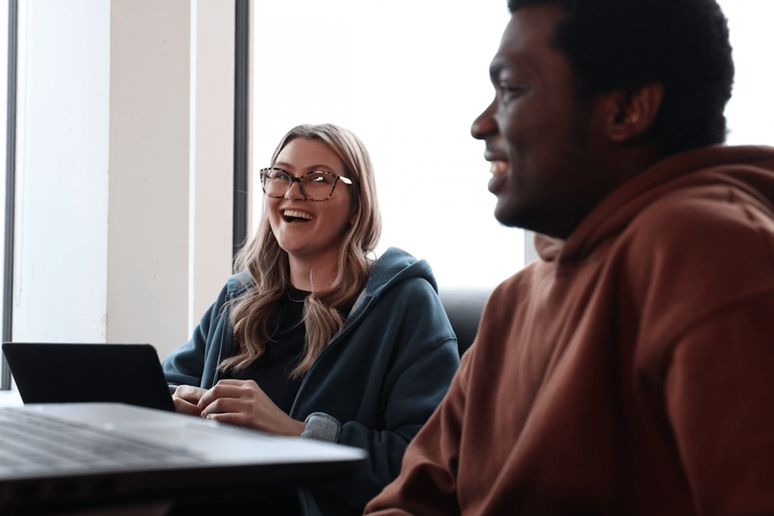 Two students sitting at a table
