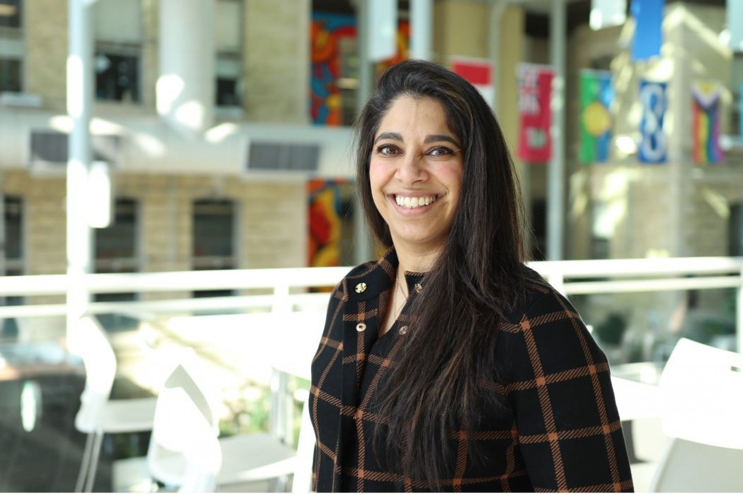 Dr. Farhana Shariff stands in the Brodie Centre atrium on the UM Bannatyne campus.