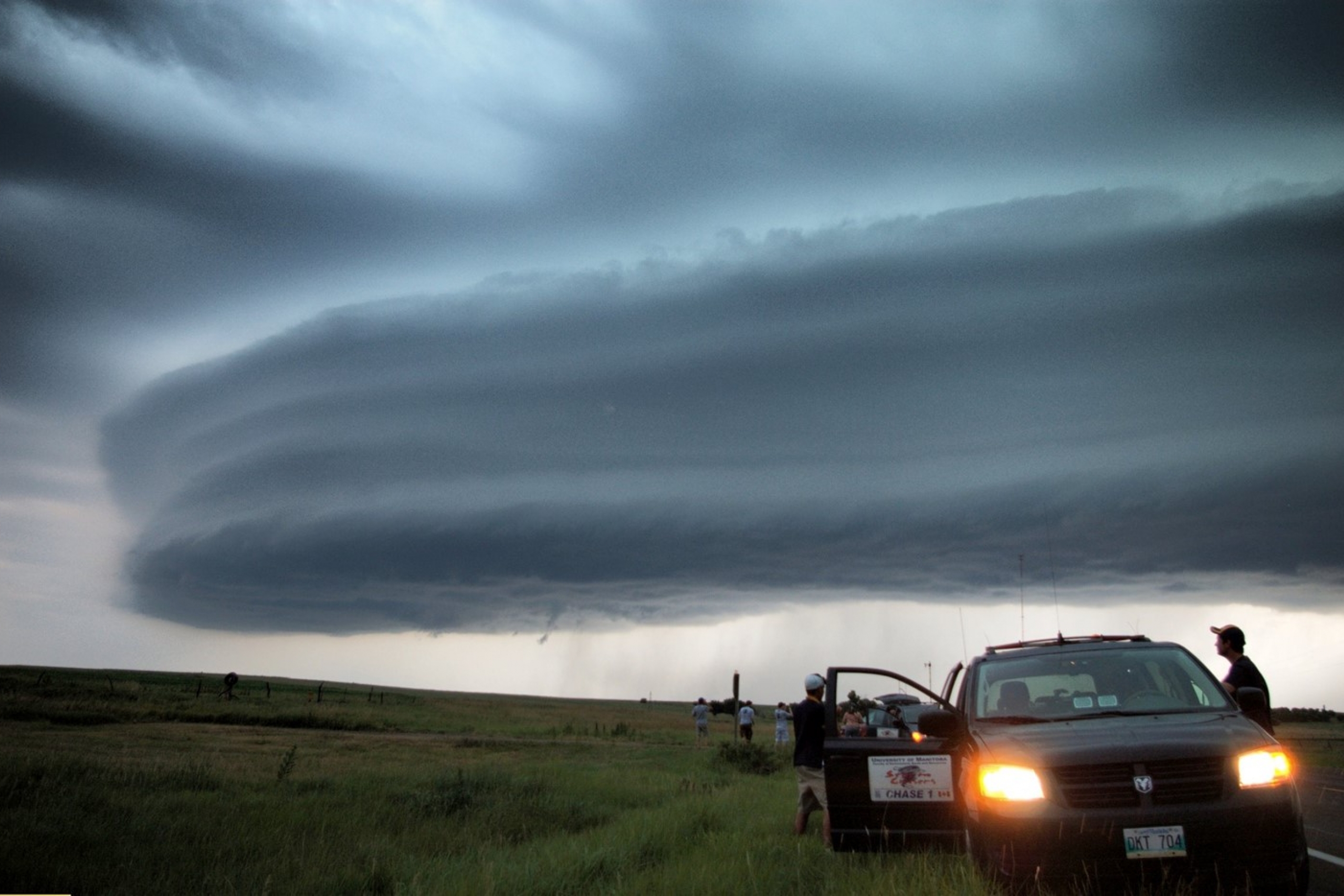 Layers of clouds forming over a field.