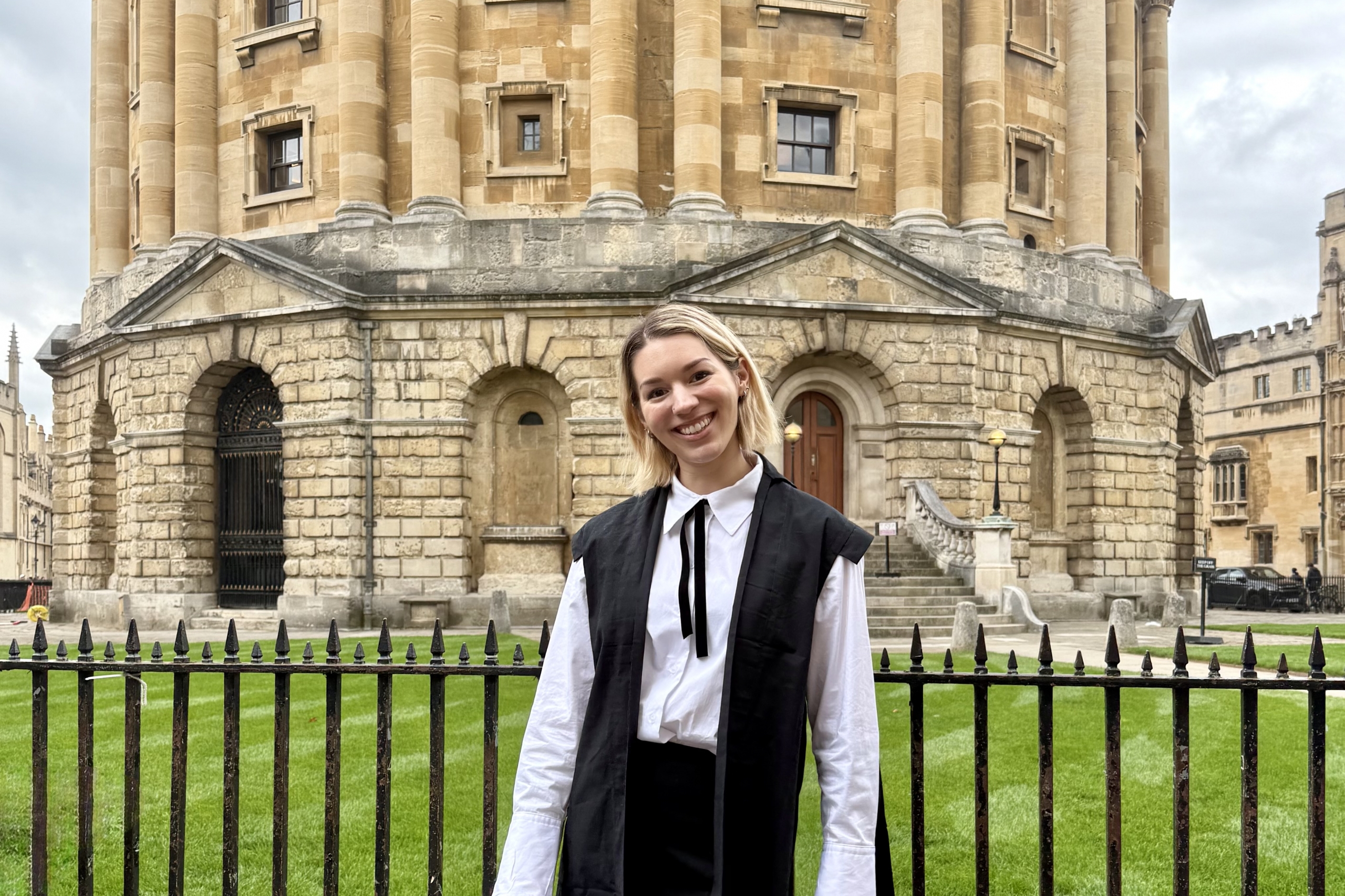 Talia Smith stands in front of a historic building