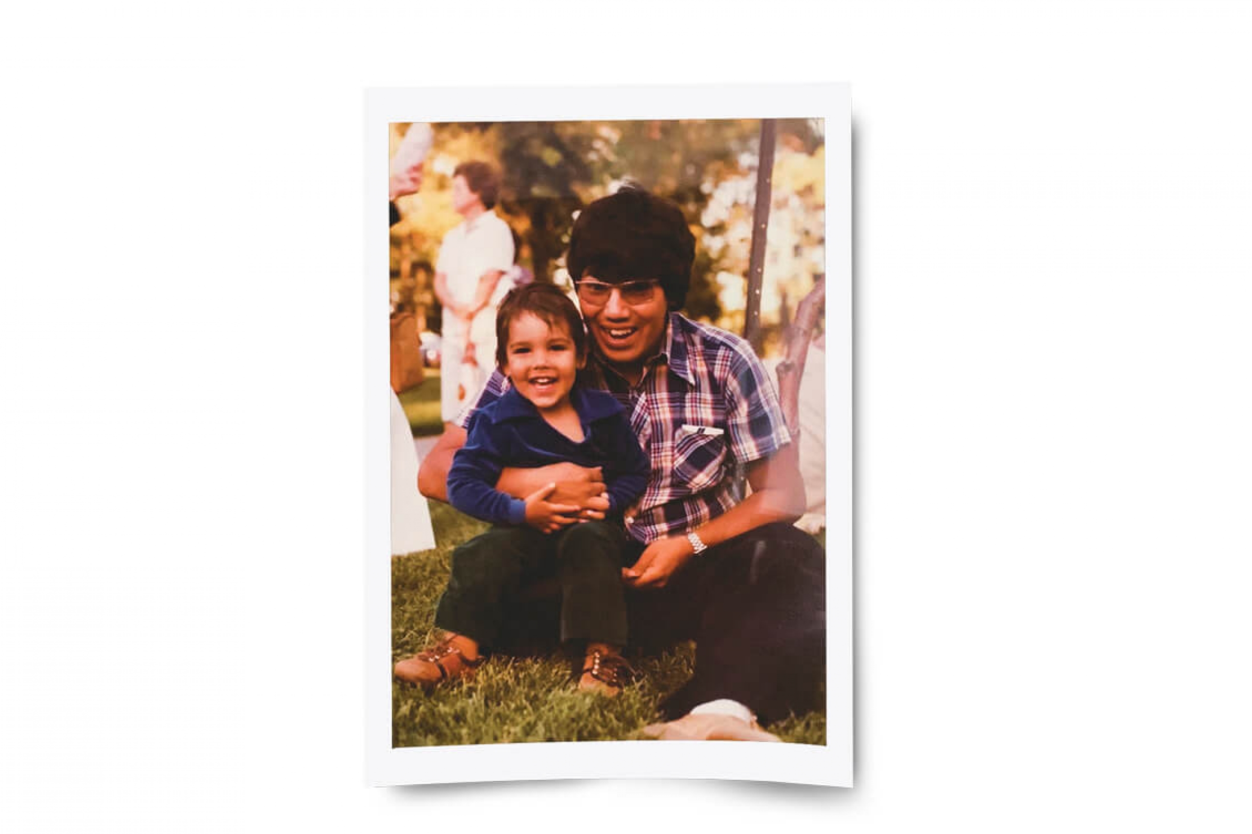 Murray Sinclair and his young son pose in an old photo taken outdoors.