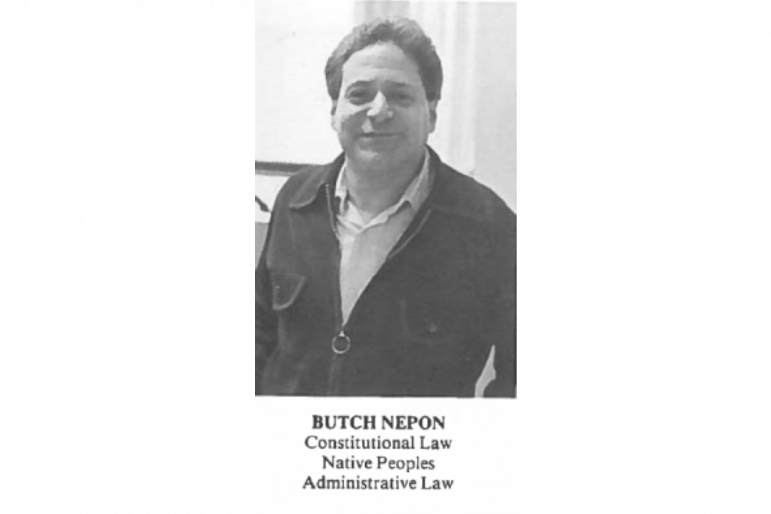 Butch Nepon smiling in a 1987 yearbook photo of him as law professor.