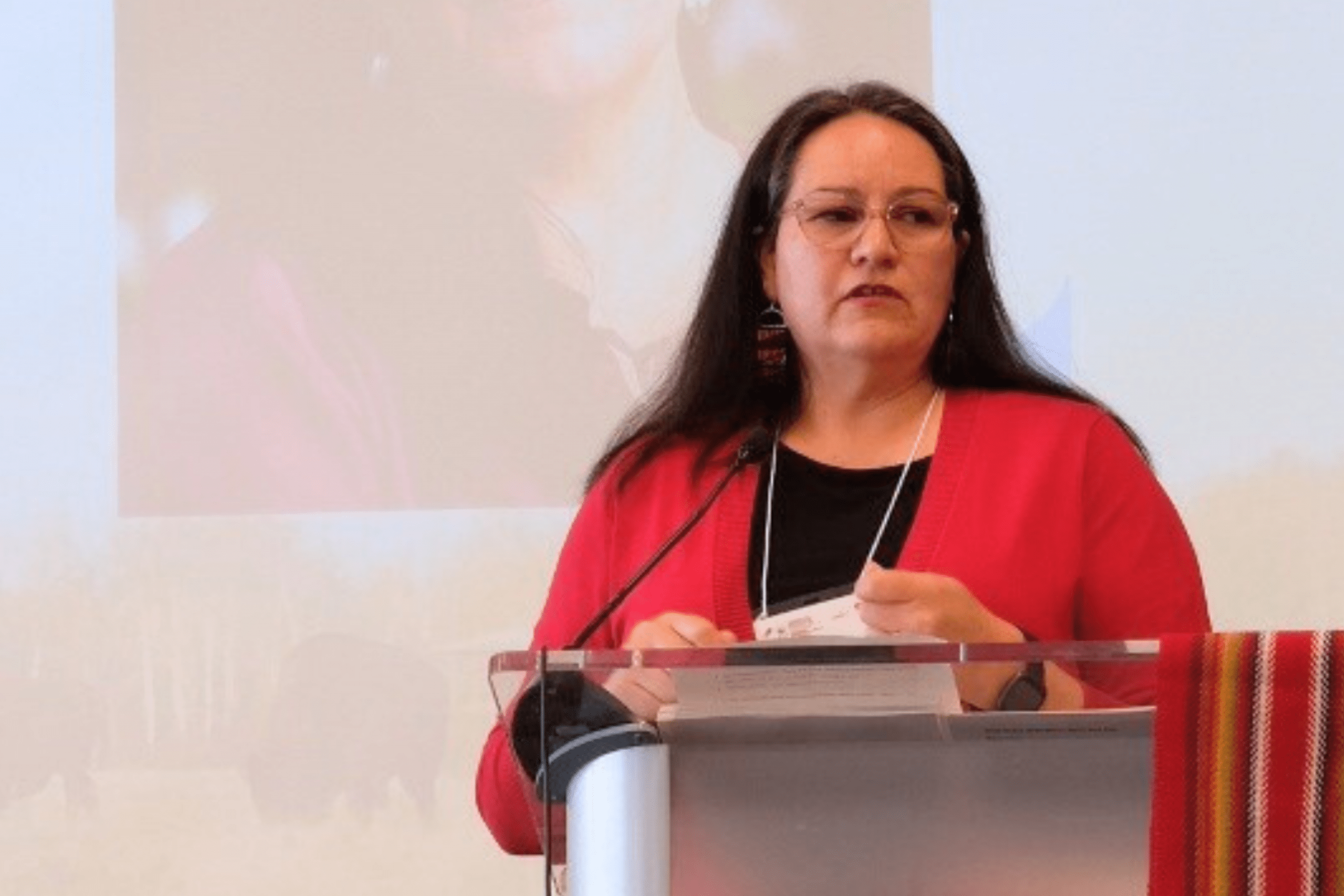 Assistant Vice-President (Indigenous) Christine Cyr speaks at the podium during an event.
