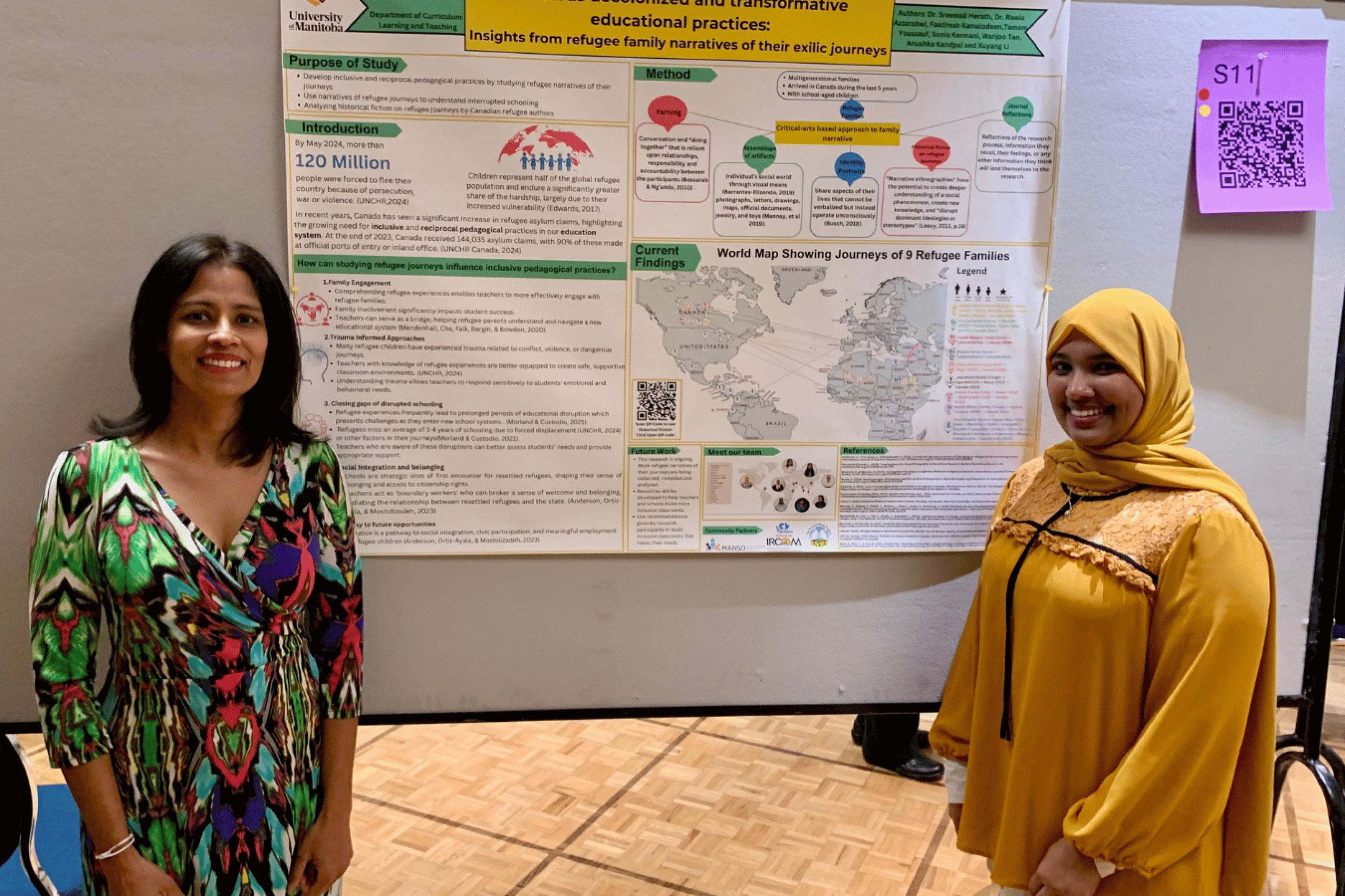 a student and advisor by a research poster