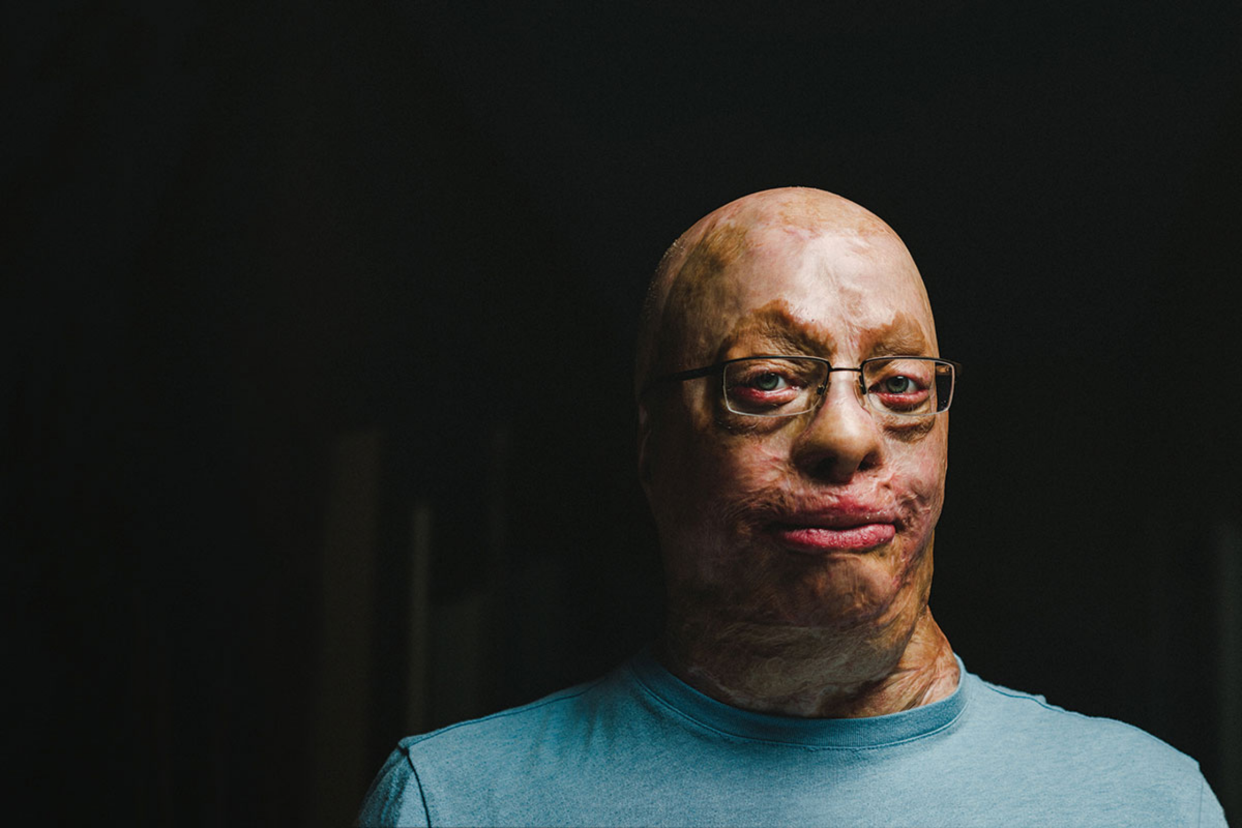 a man against a black background