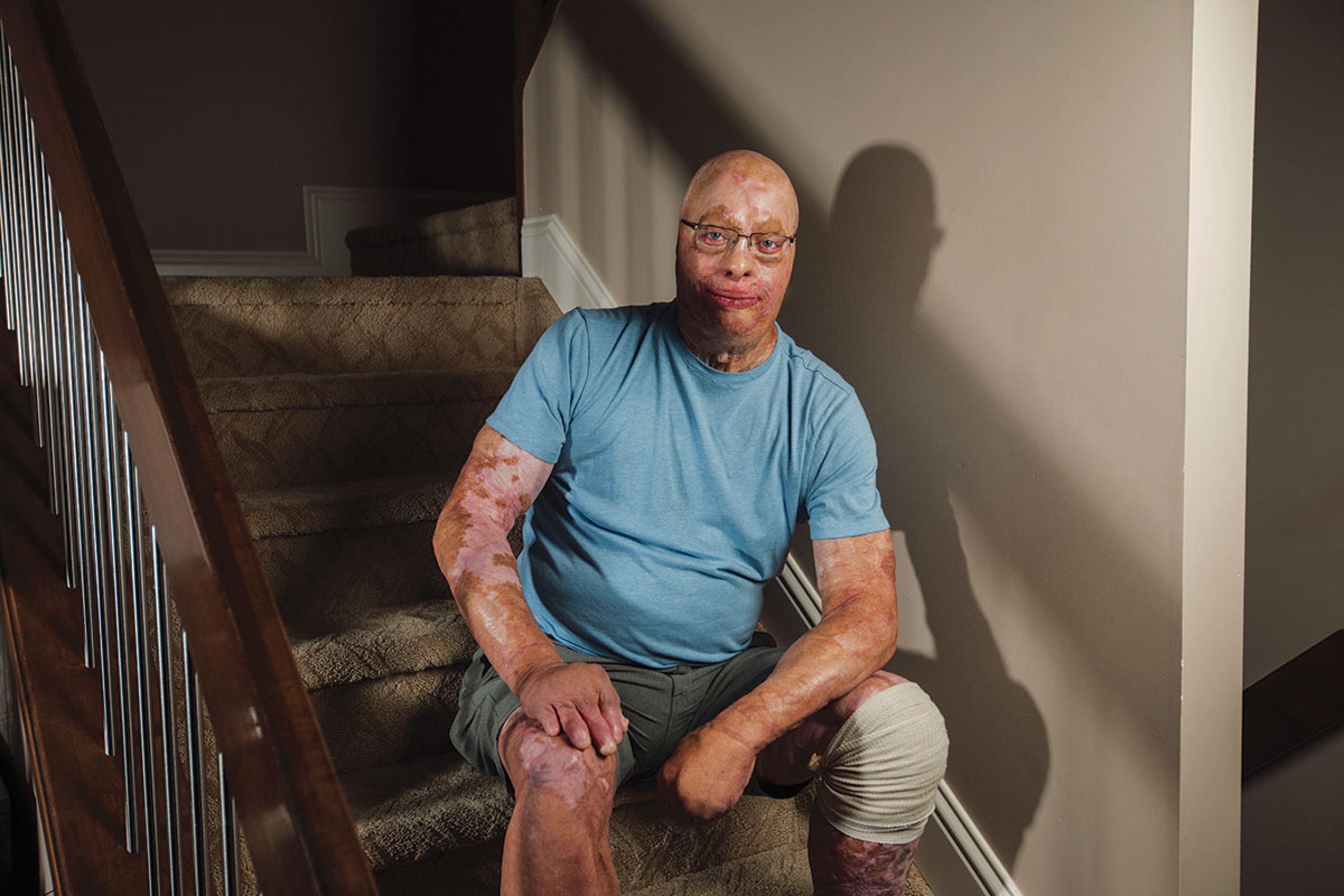 A man sitting on a staircase.