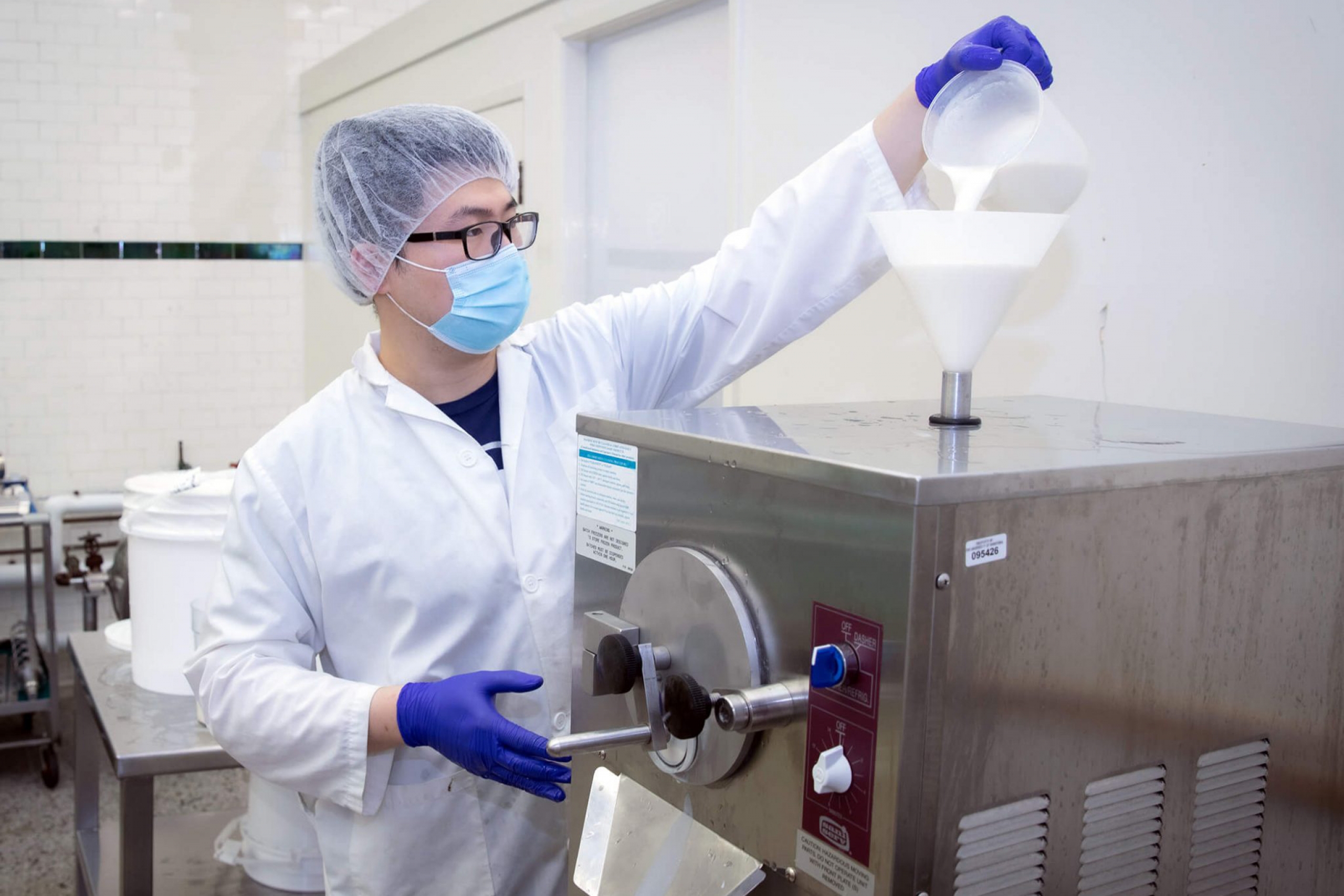 A tech runs tests on fluids