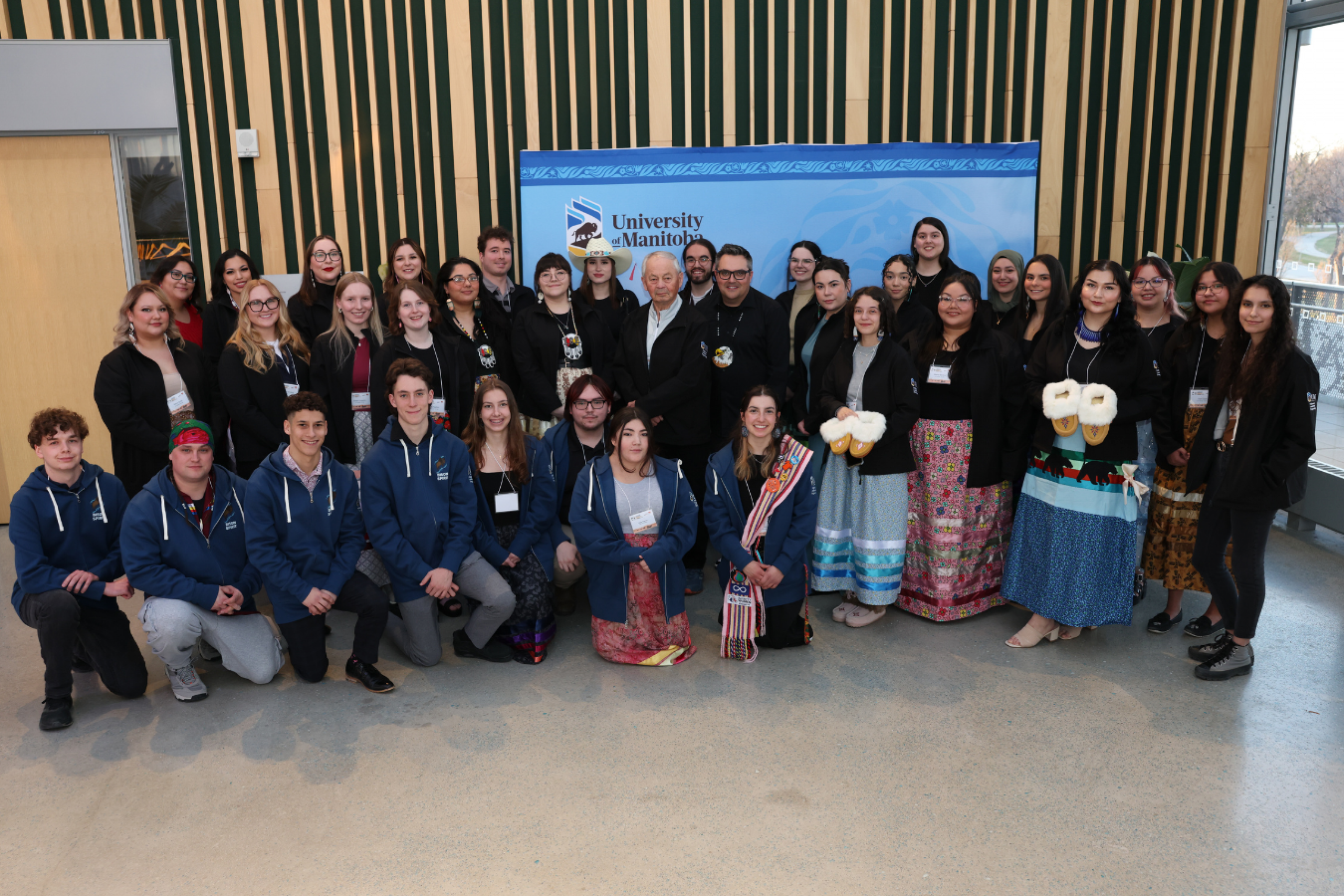 Group photo of UM Indigenous Leadership program participants and organizers standing together at the event.