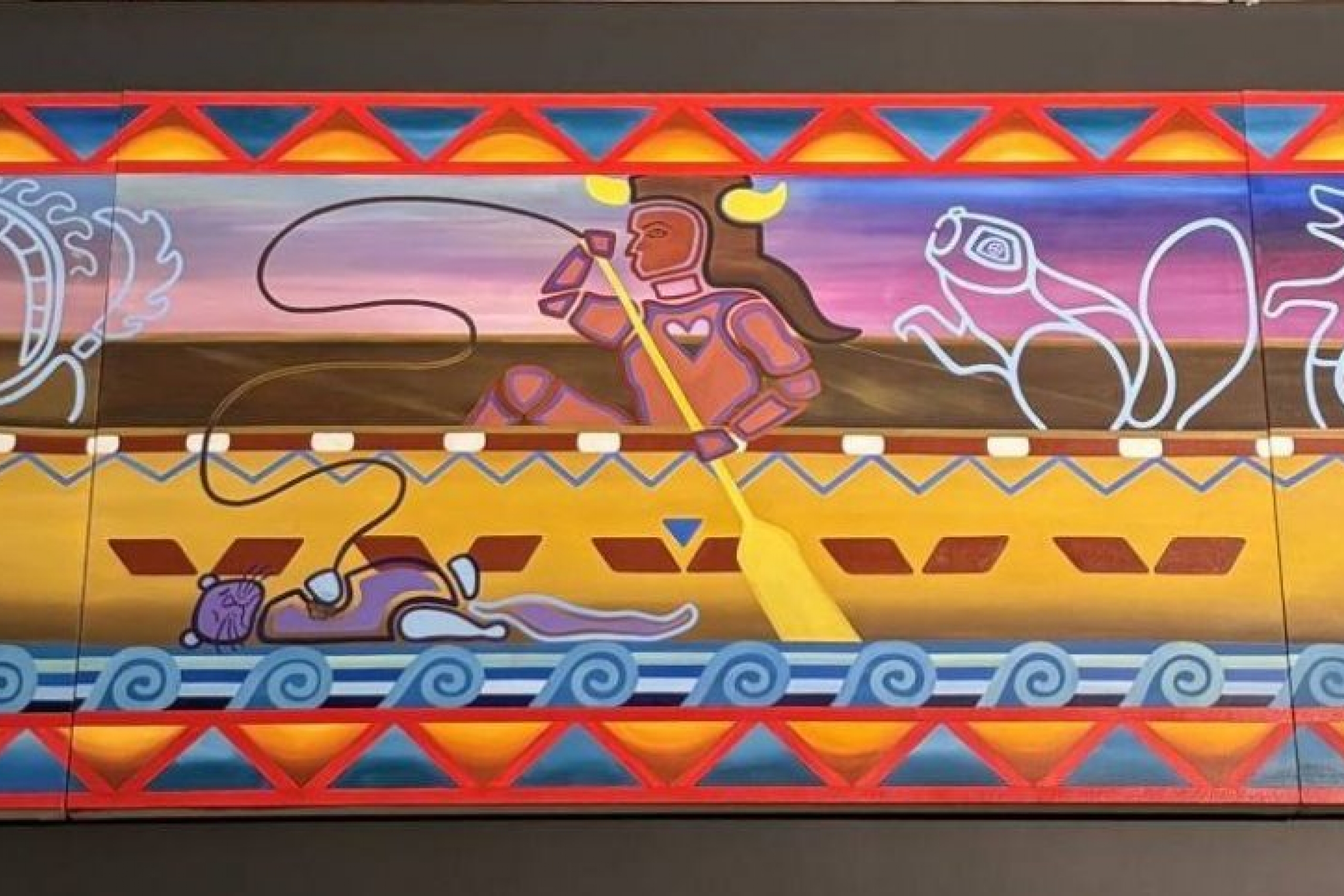 A mural featuring people in a canoe.