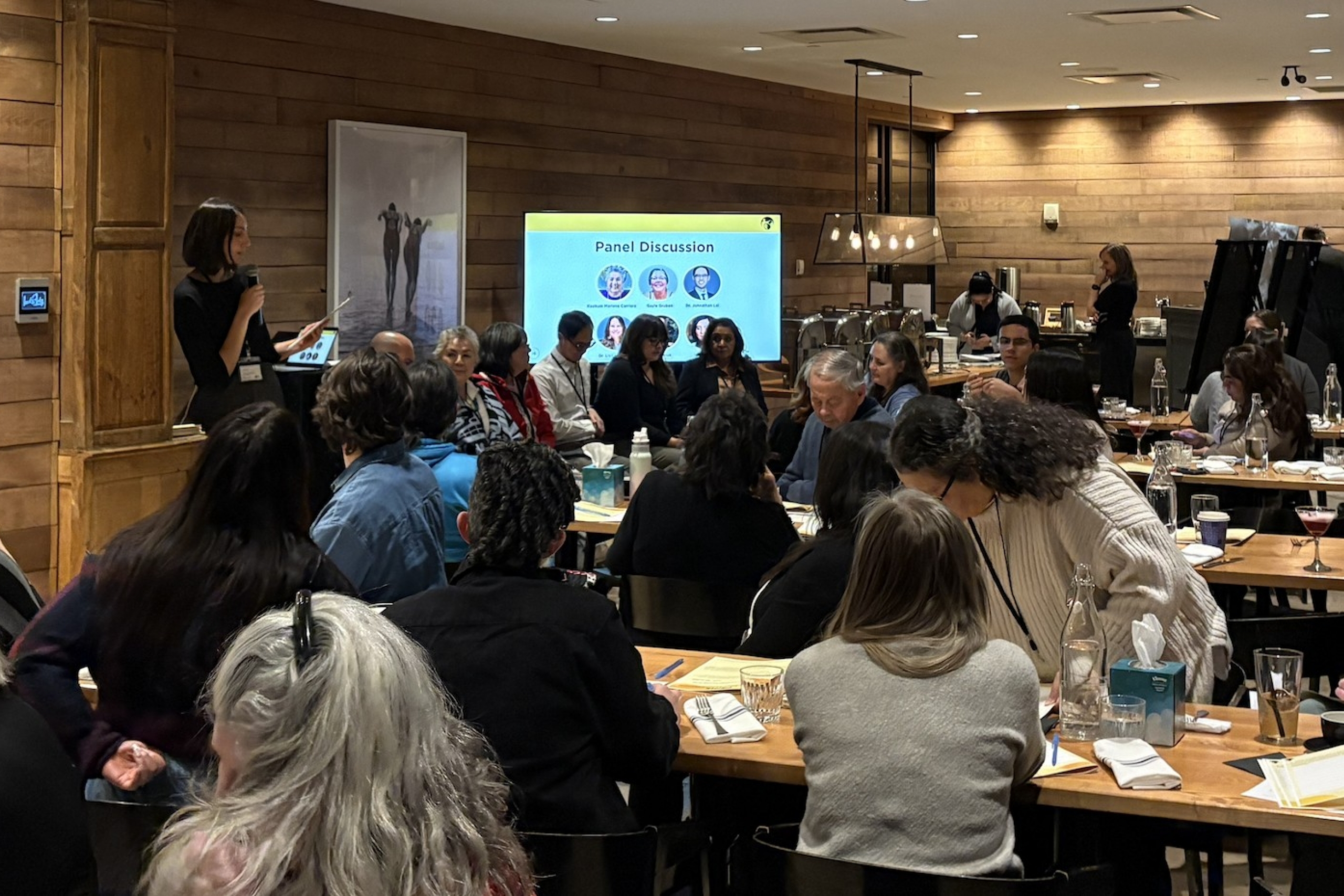 Dr. Leslie E. Roos presents at a community network event in Winnipeg.