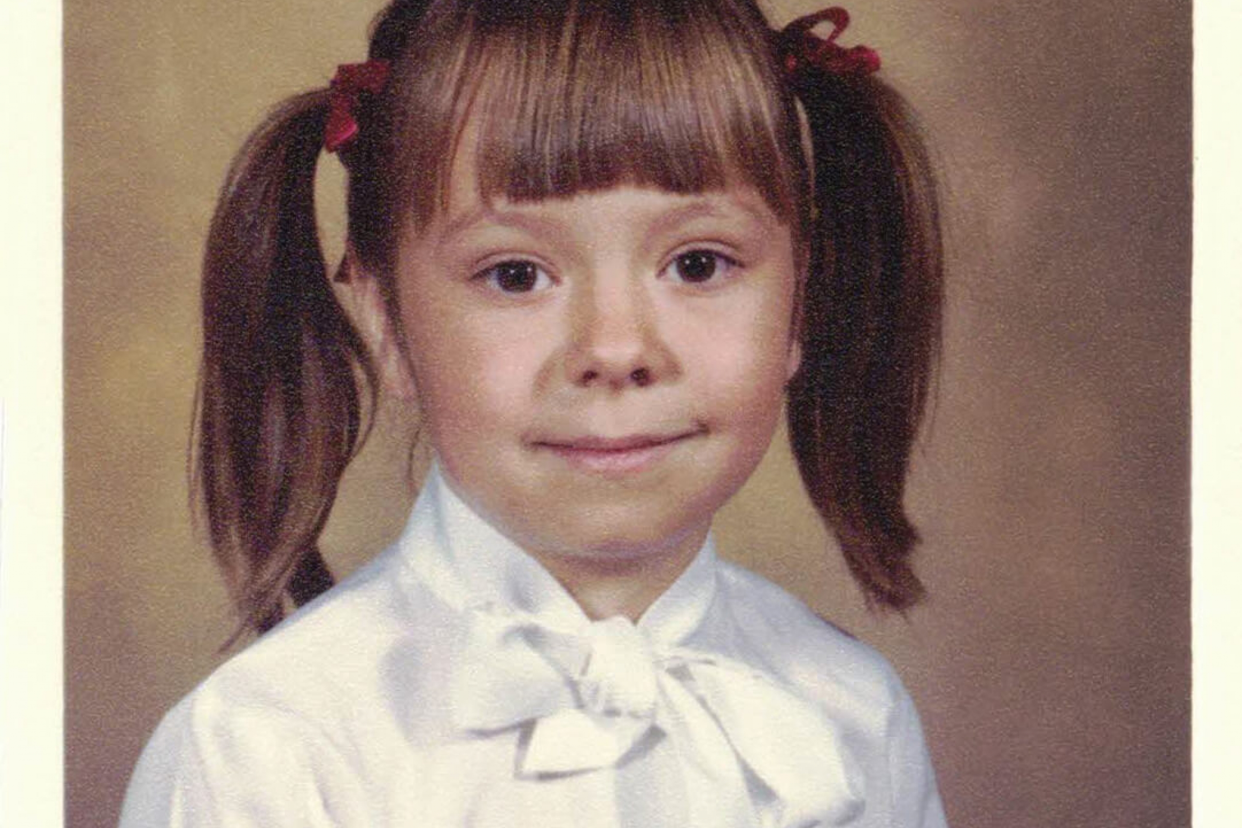 a school photo of a little girl