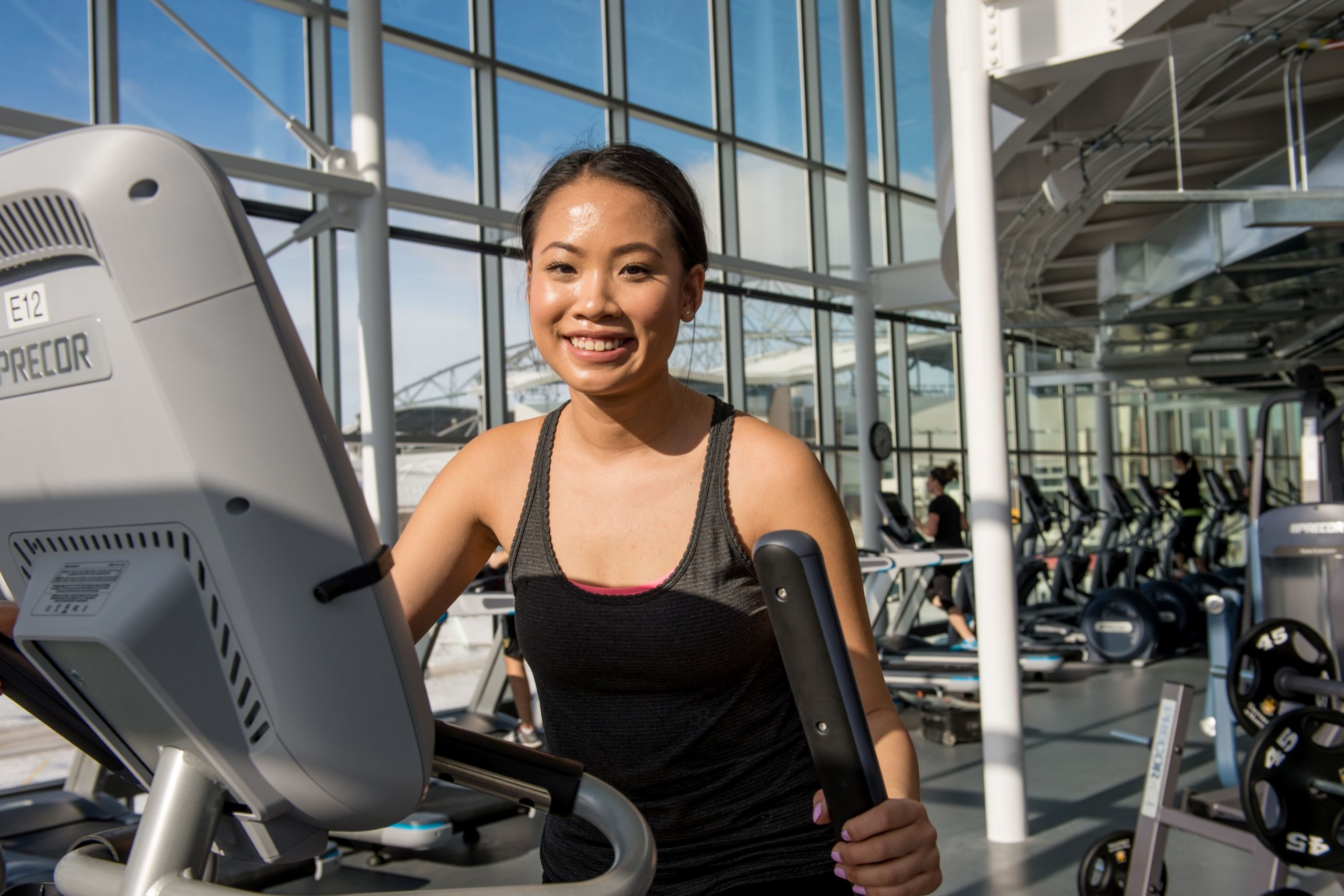 A student exercises in the campus gym. 