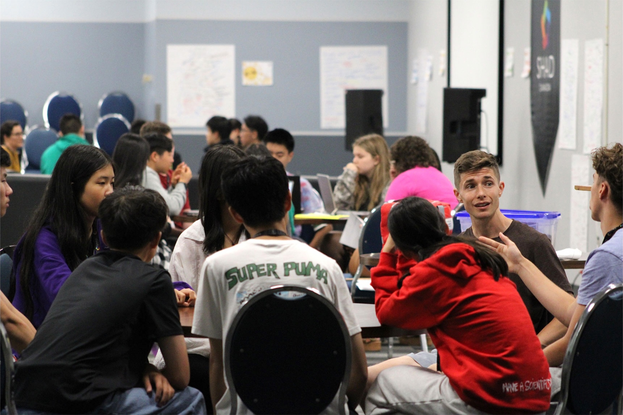 Participants of the SHAD 2025 having discussions with Daniel Heschuk.