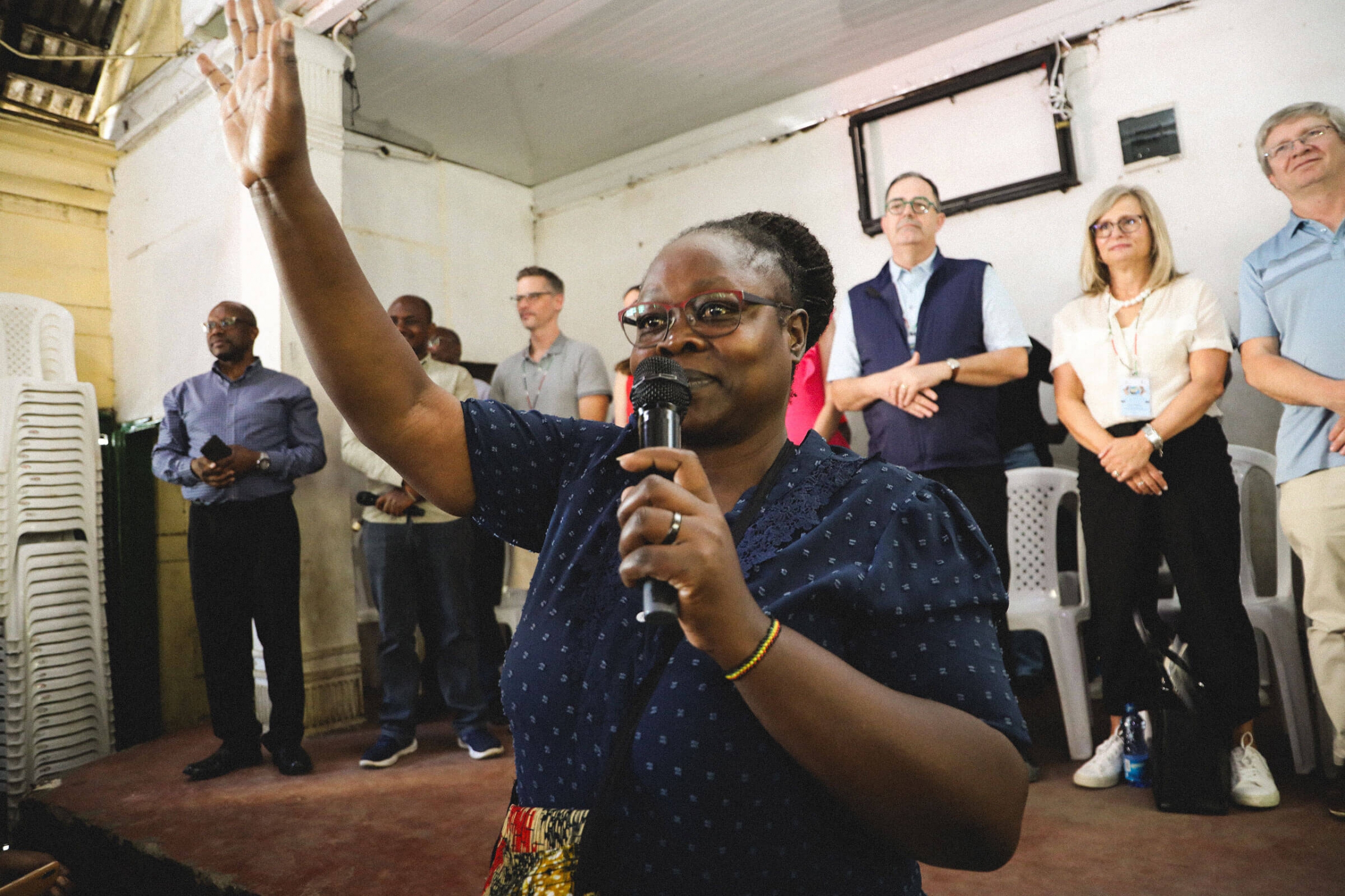 A woman addressed the crowd holding a microphone