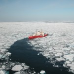 Ship going through Arctic ice