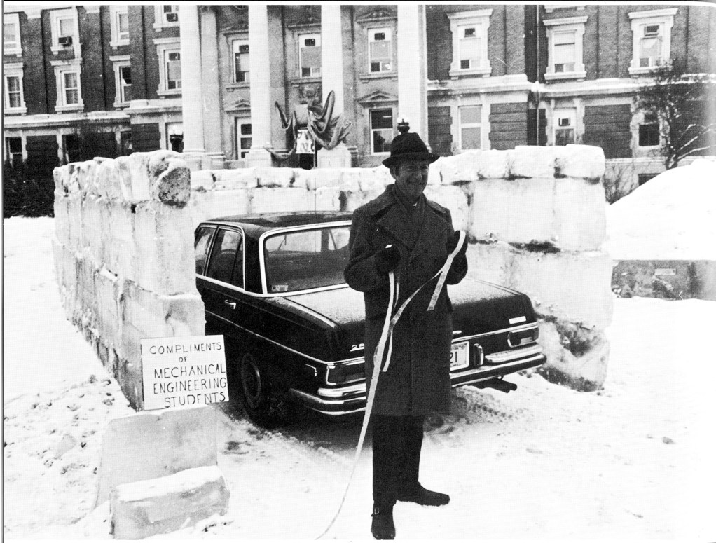 1975 photo of ice blocks surrounding university president's car
