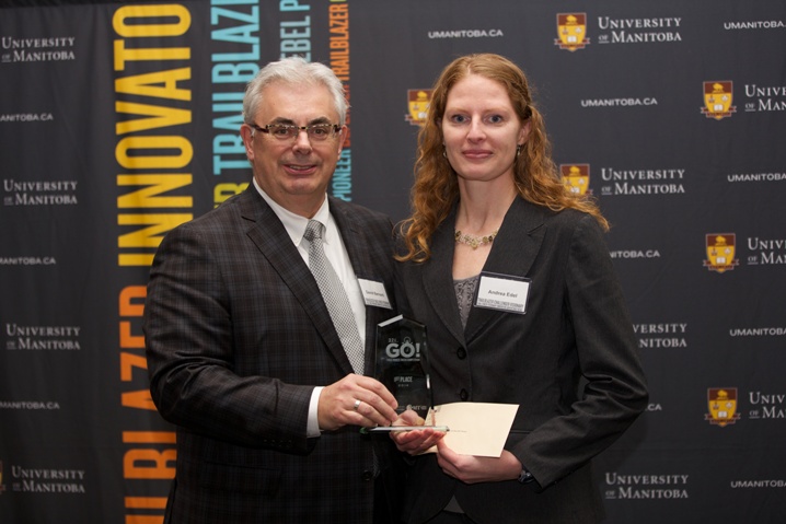 President and Vice-Chancellor, Dr. David T. Barnard awards Andrea Edel with the 1st Place win.