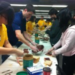 students making peanut bu7tter and jam sandwiches for charity