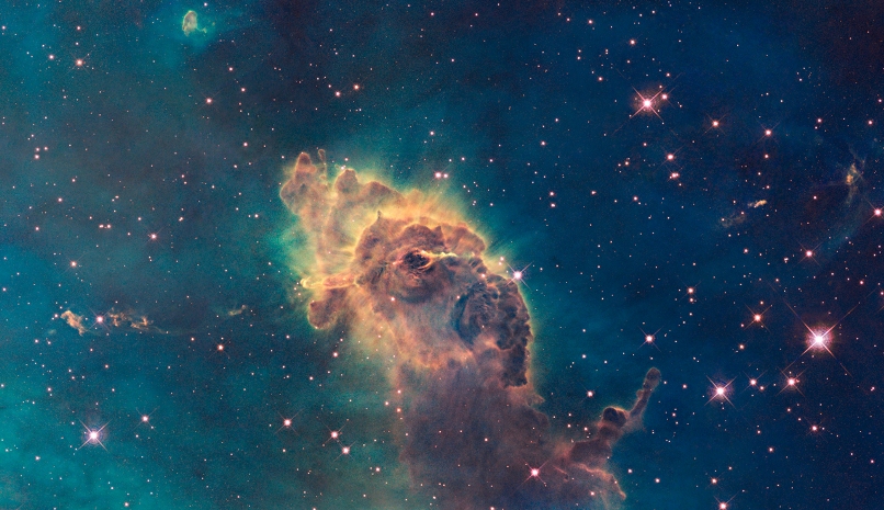 A pillar of gas in the Carina Nebula is bathed in the light of hot, massive stars. Radiation and fast winds from the stars sculpt the pillar and cause new star formation within it. Credit: NASA, ESA, and the Hubble SM4 ERO Team