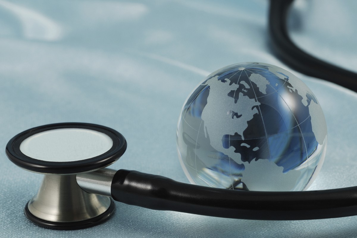 a stethoscope wraps around the globe