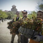 Campus Beautification day people smiling and holding flowers
