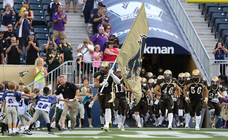 Bisons Football team charges onto the field