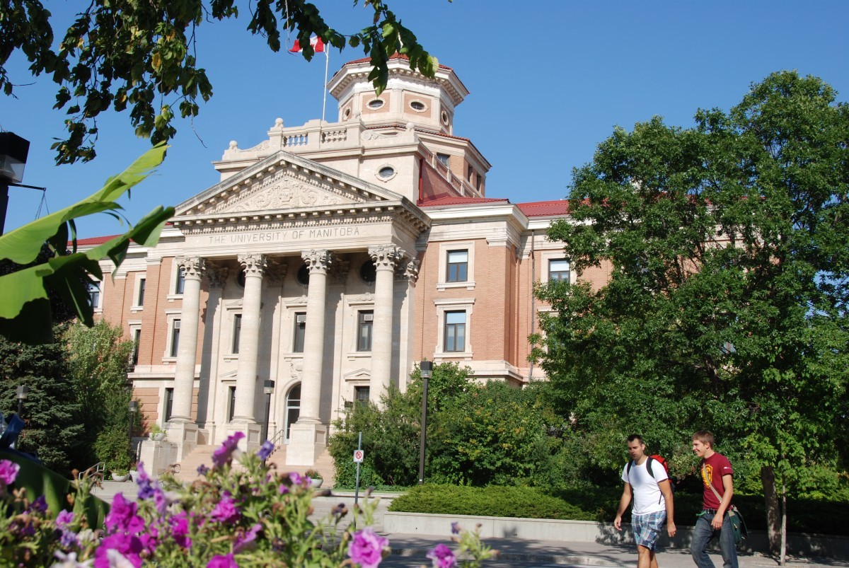 students walk in front of the Administration building