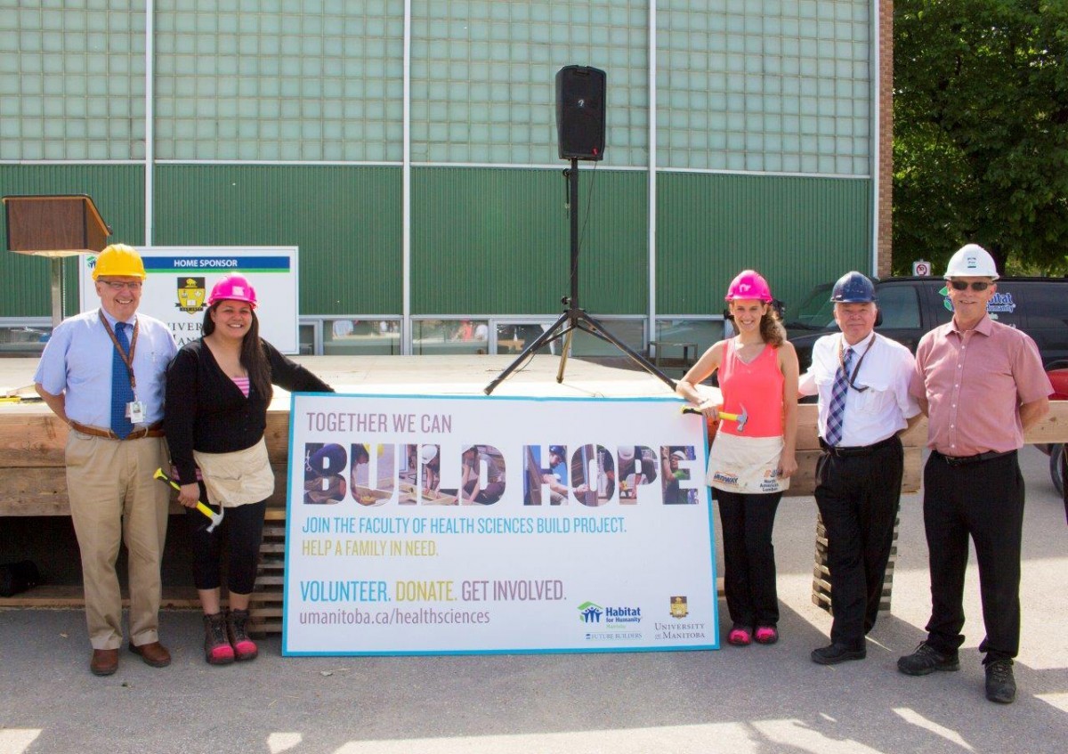 At the Habitat for Humanity build launch in 2014: (left to right), Dean Brian Postl, new homeowner Michelle, Med 2 student Gail Pollard, Dr. Bruce Martin and Habitat for Humanity Manitoba CEO Sandy Hopkins