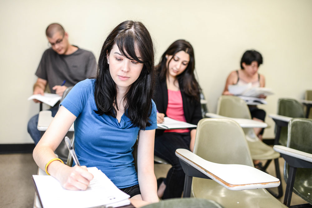 Girl writes a test.