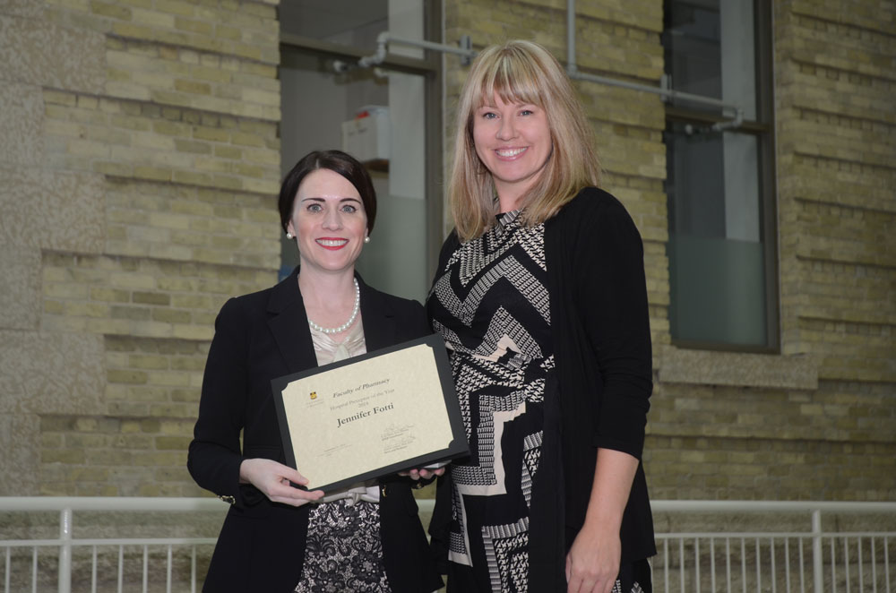 Hospital Preceptor of the year, Jennifer Fotti (left), receiving her award from Miss Kelly Brink, College of Pharmacy