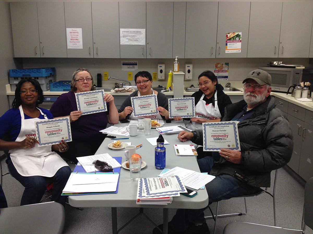 A group finishing the Community Tables program, which provides training in basic nutrition, food safety, and traditional Indigenous foods with an urban focus.