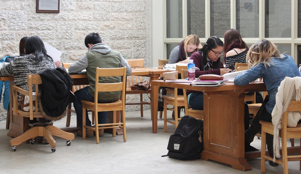 Students studying in the Elizabeth Dafoe Library.