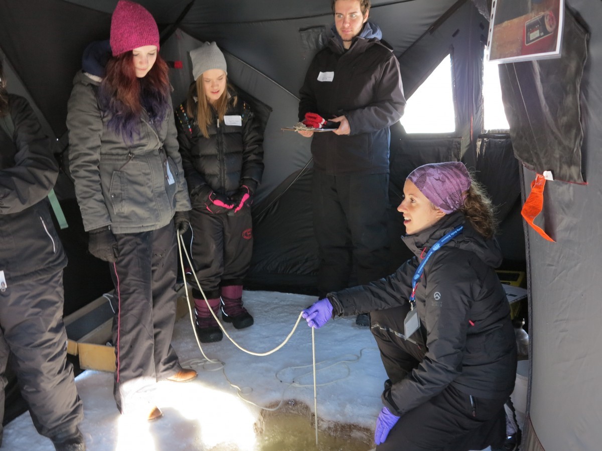 A CEOS scientist demonstrates plankton sampling in the water column.