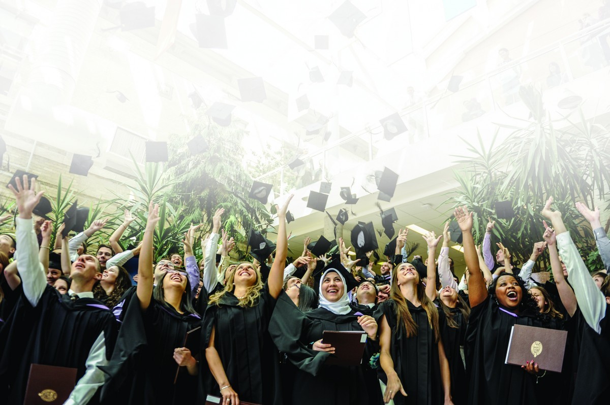 Bannatyen grads throw hats into the air after convocation