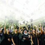Bannatyen grads throw hats into the air after convocation