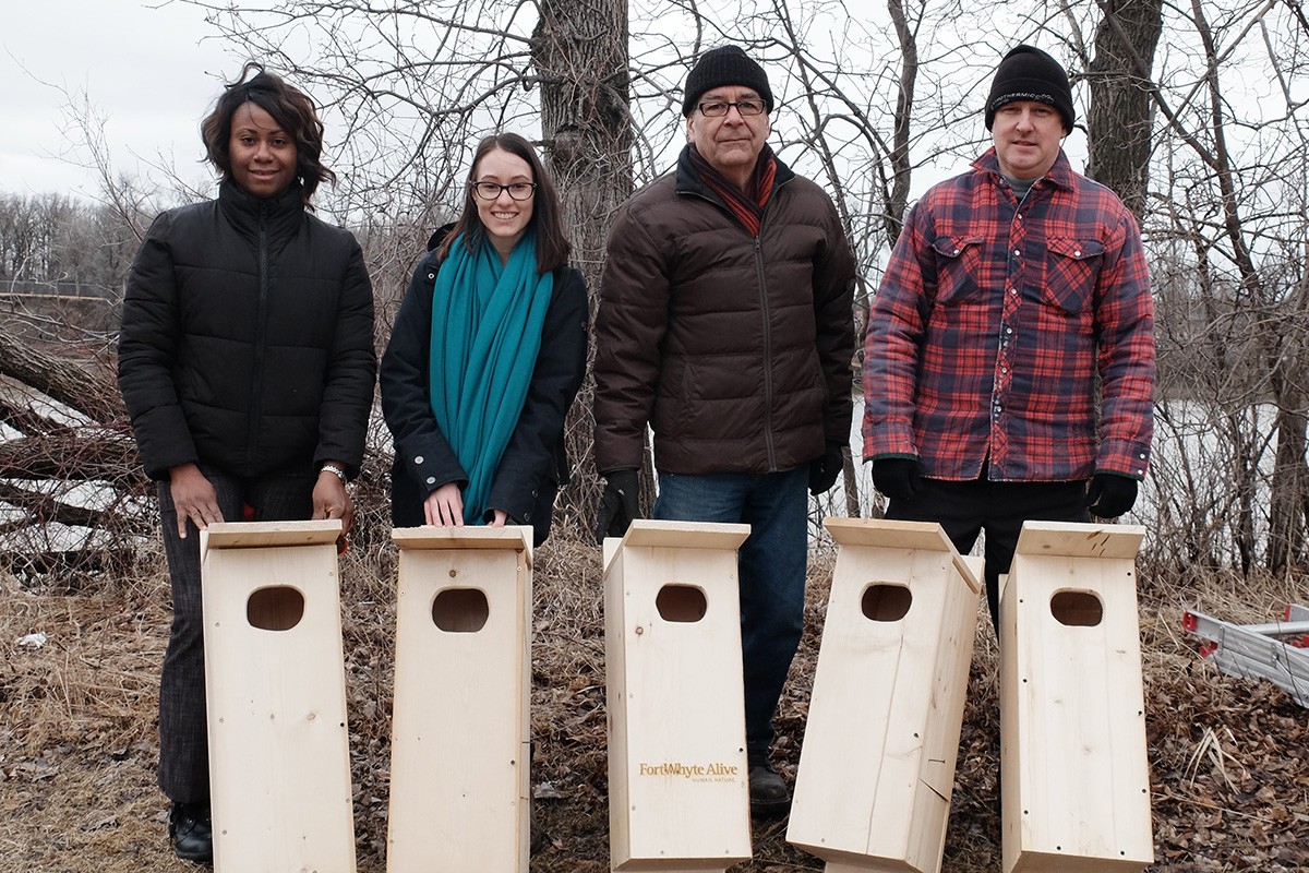 (L - R) Melissa Gayle Smith of the Office of Sustainability, Sabina Mastrolonardo, and FortWhyte volunteers Tom Goldsborough and Gilbert Gregory with five Wood Duck nest boxes installed at the University of Manitoba. // Photo by Whitney Crooks