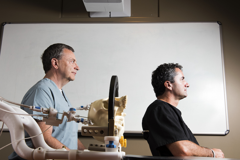 Mark Torchia (left) and Richard Tyc brought to market the Neuroblate, a device that is now saving lives across North America