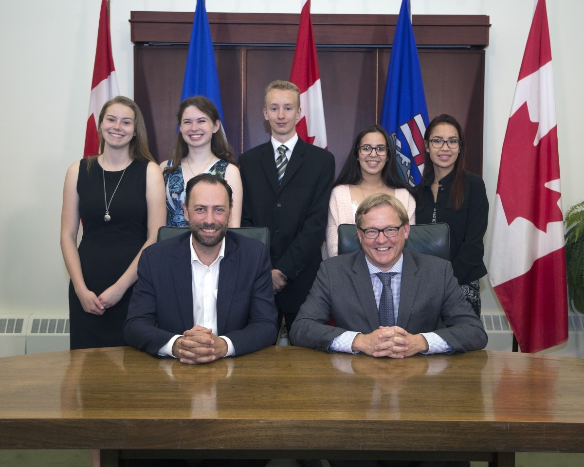 Signatories of the new Alberta education agreement (front l-r, Ry Moran, Director, National Centre for Truth and Reconciliation, University of Manitoba and Alberta Education, Minister David Eggen).