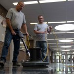 Floors in Fletcher Argue Building get a resurfacing treatment, one of many summer deep clean and repair projects undertaken by caretakers this summer. Pictured here are caretakers Peter Kielich and Ian Kemball. // Photos by Adam Dolman