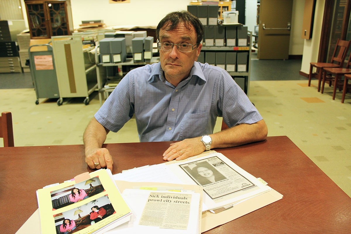 Brian Hubner, acquisitions and access archivist, with some of the items from the Lynn Moss Sharman fonds.