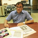 Brian Hubner, acquisitions and access archivist, with some of the items from the Lynn Moss Sharman fonds.