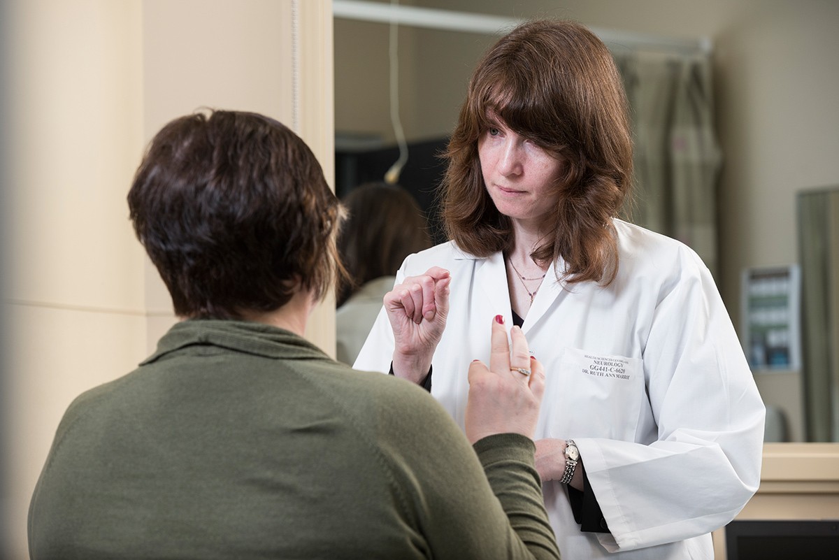 Dr. Ruth Ann Marrie meets with a patient.