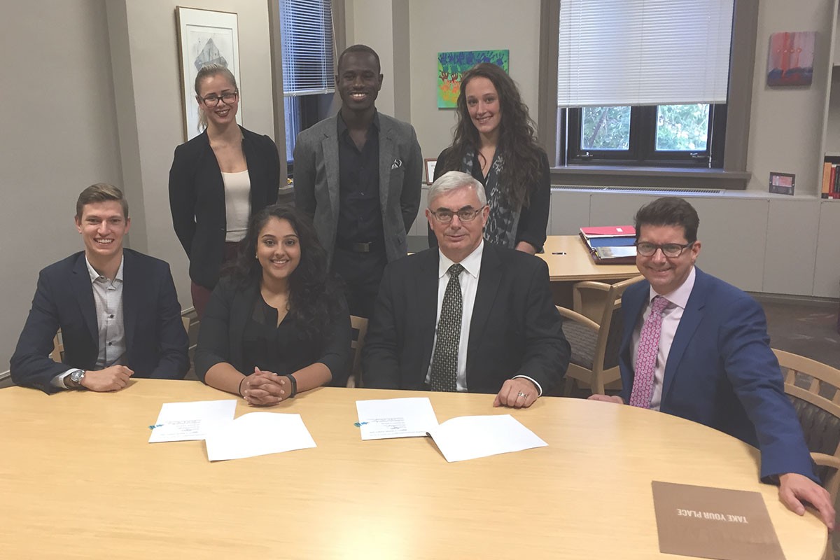 (Back row L-R) UMSU executives Jessica Smith, Wilfred Sam-King, Dara Hallock. ( Front row l-r) UMSU executives Adam Pawlak, Tanjit Nagra, University of Manitoba President David Barnard and Vice-President (External) John Kearsey.