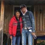 Evelyn Baxter, Charlie Wenjack’s sister, with Gord Downie outside her home in Ogoki Post, Ont. // PHOTO: Grand Chief Alvin Fiddler