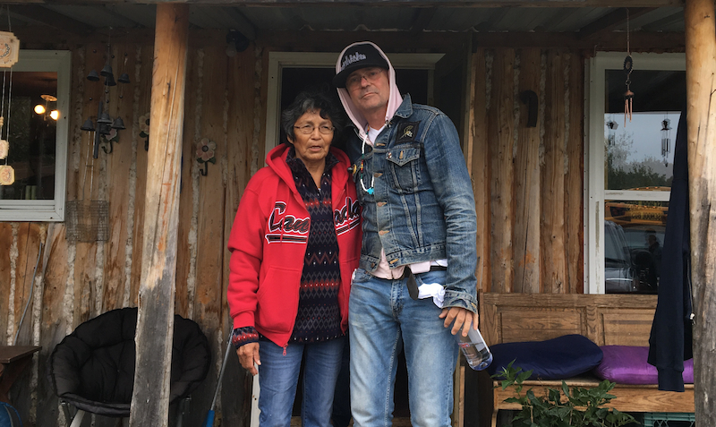 Evelyn Baxter, Charlie Wenjack’s sister, with Gord Downie outside her home in Ogoki Post, Ont. // PHOTO: Grand Chief Alvin Fiddler