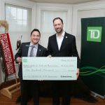 TD's Anthony Yu (left) presents a cheque to Ry Moran, director of NCTR
